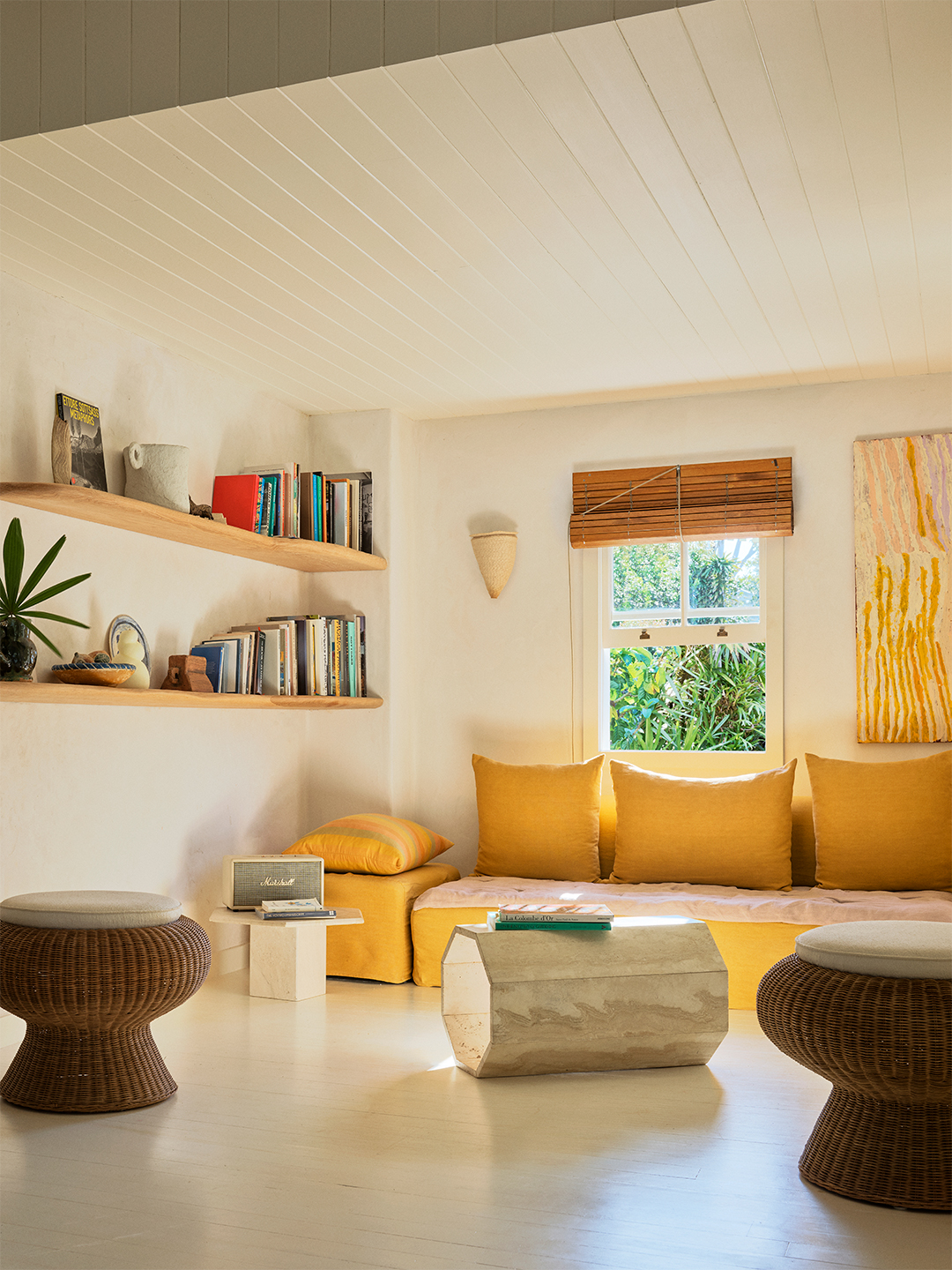 living room with plush yellow seating