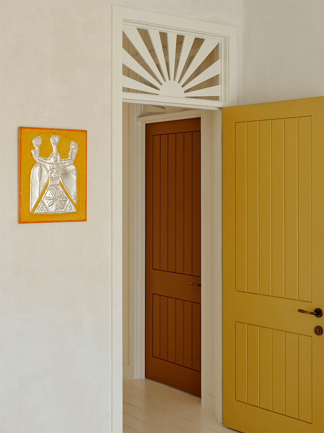 doorway with sunburst overhead