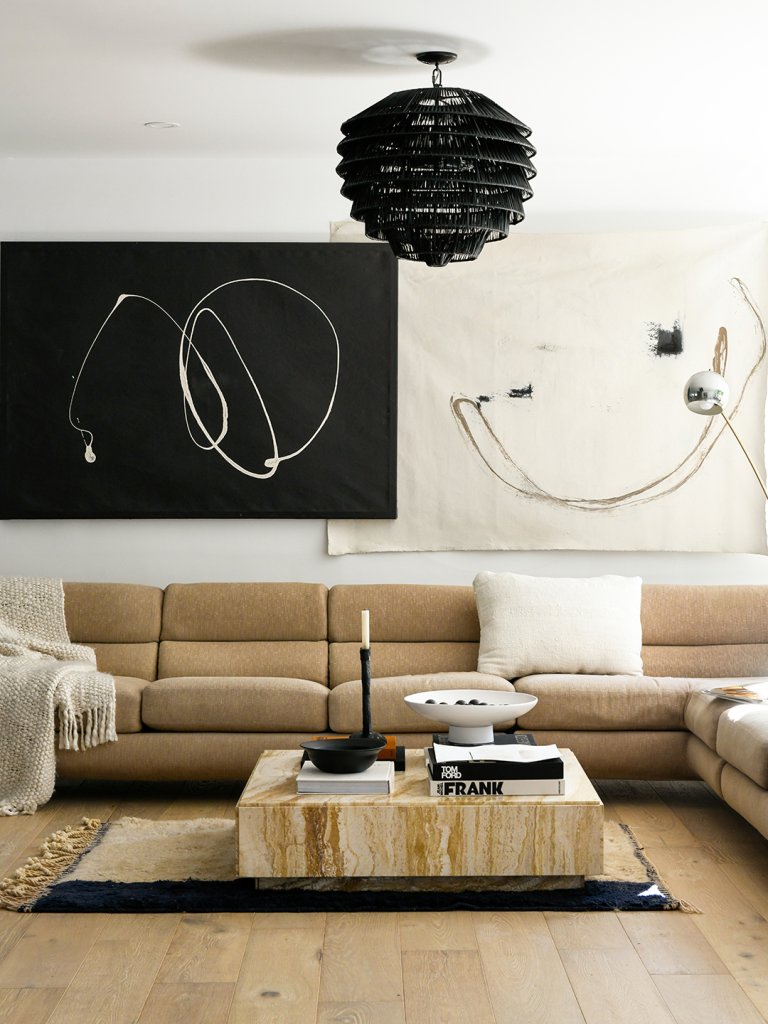 living room with black and white are and being sofa