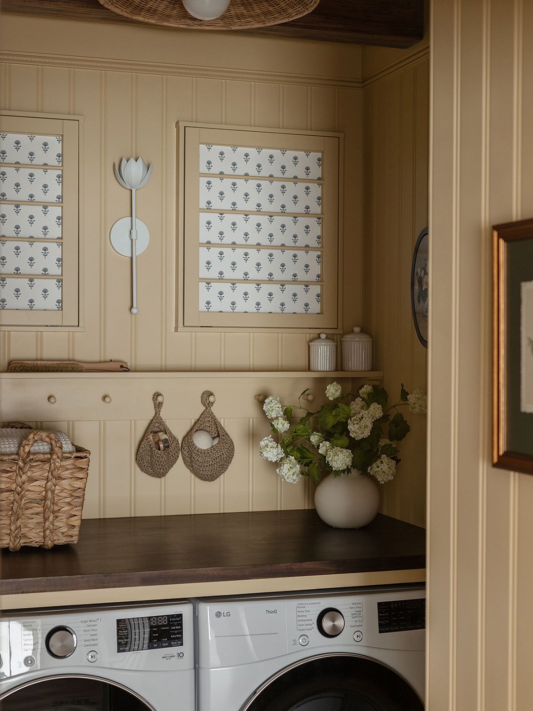 cream laundry room with hanging rail