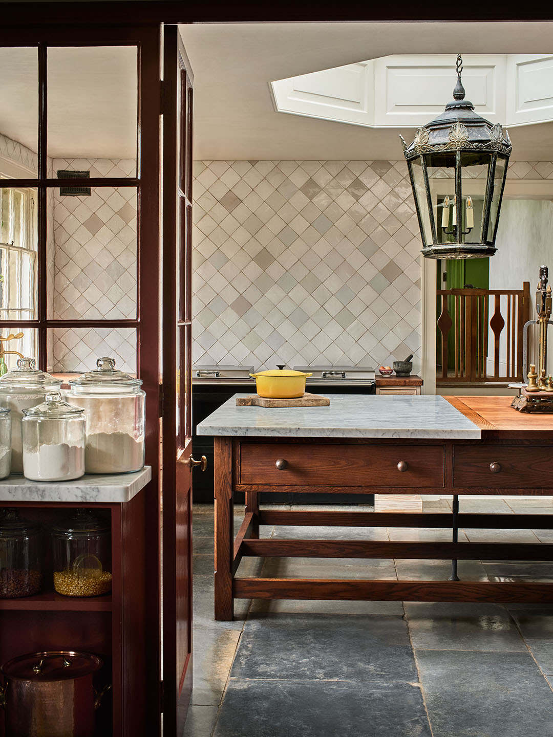 kitchen with tiled wall and wood island