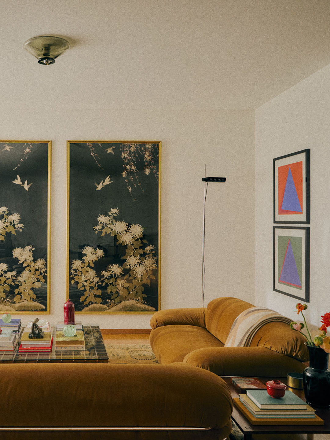 living room with tan sofas and artwork on walls