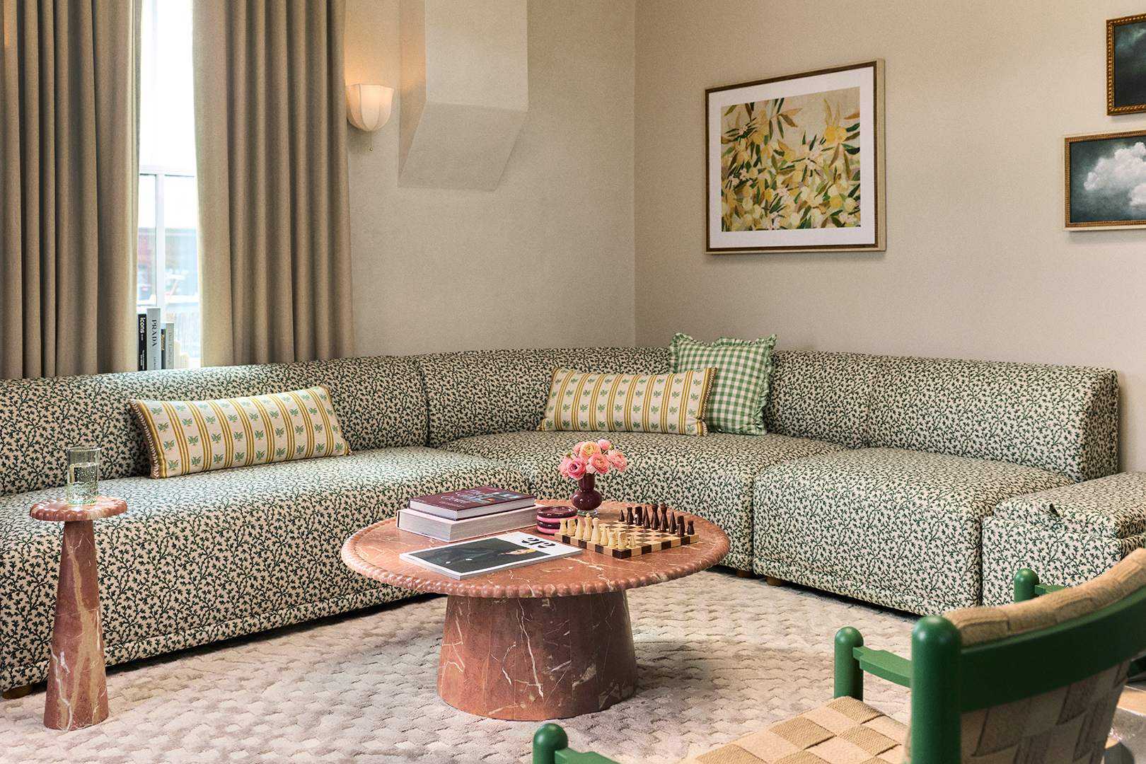 hotel suite with sectional sofa and round coffee table