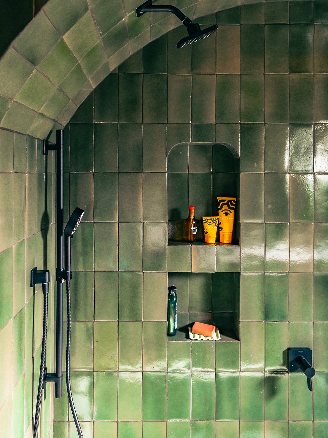 green-tiled shower detail