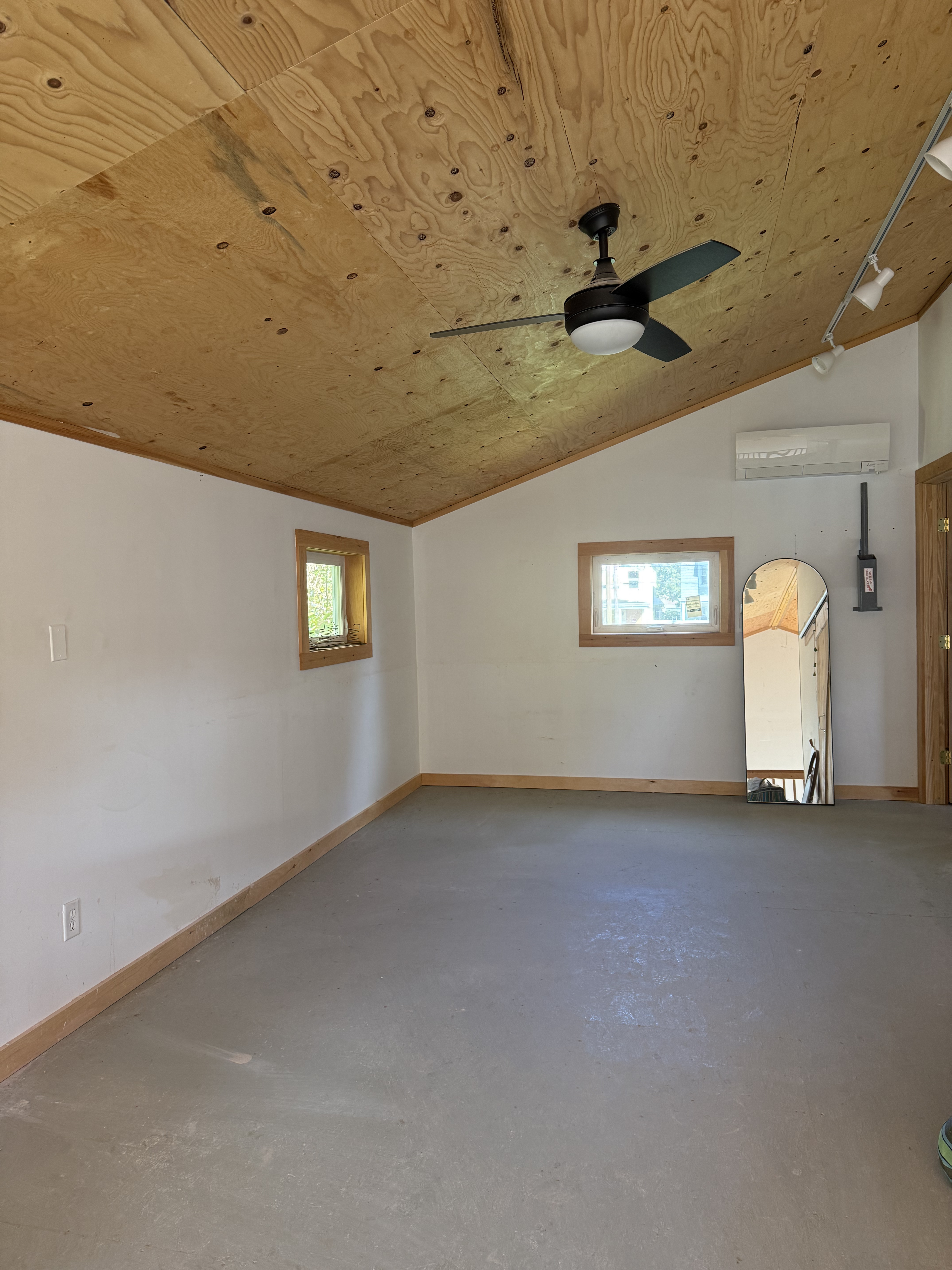 grey and wood and white room with slanted ceiling