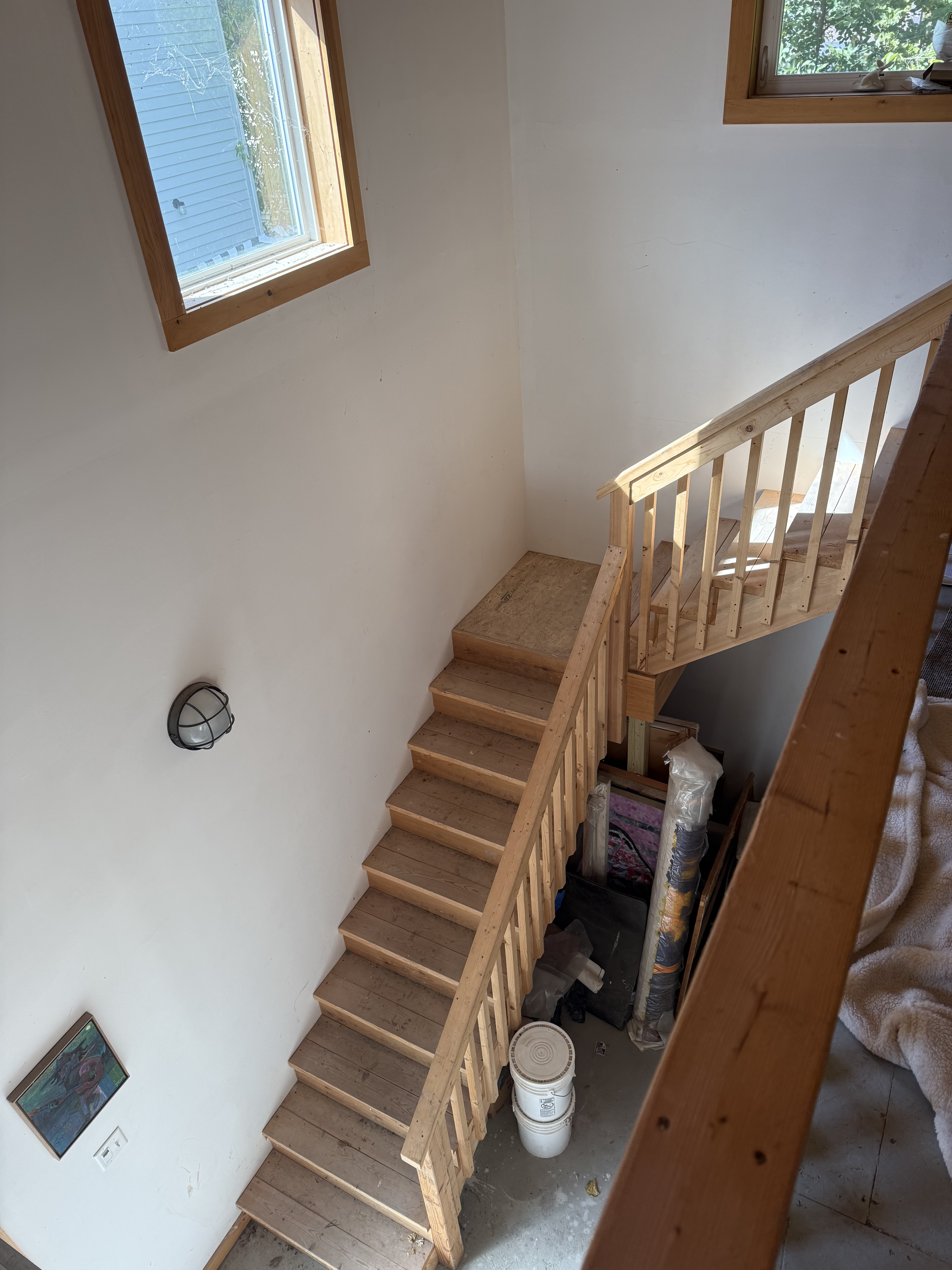 two-flight wooden stairs in a large room