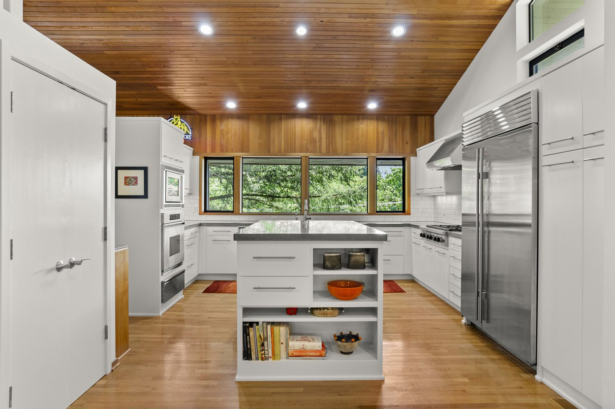 kitchen with white cabinets and wood ceiling