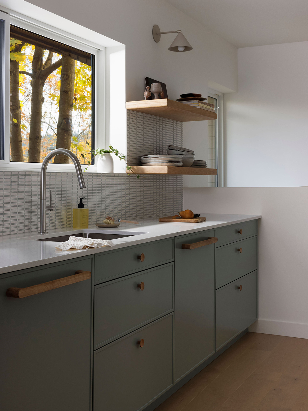 kitchen with sink and window and floating shelves
