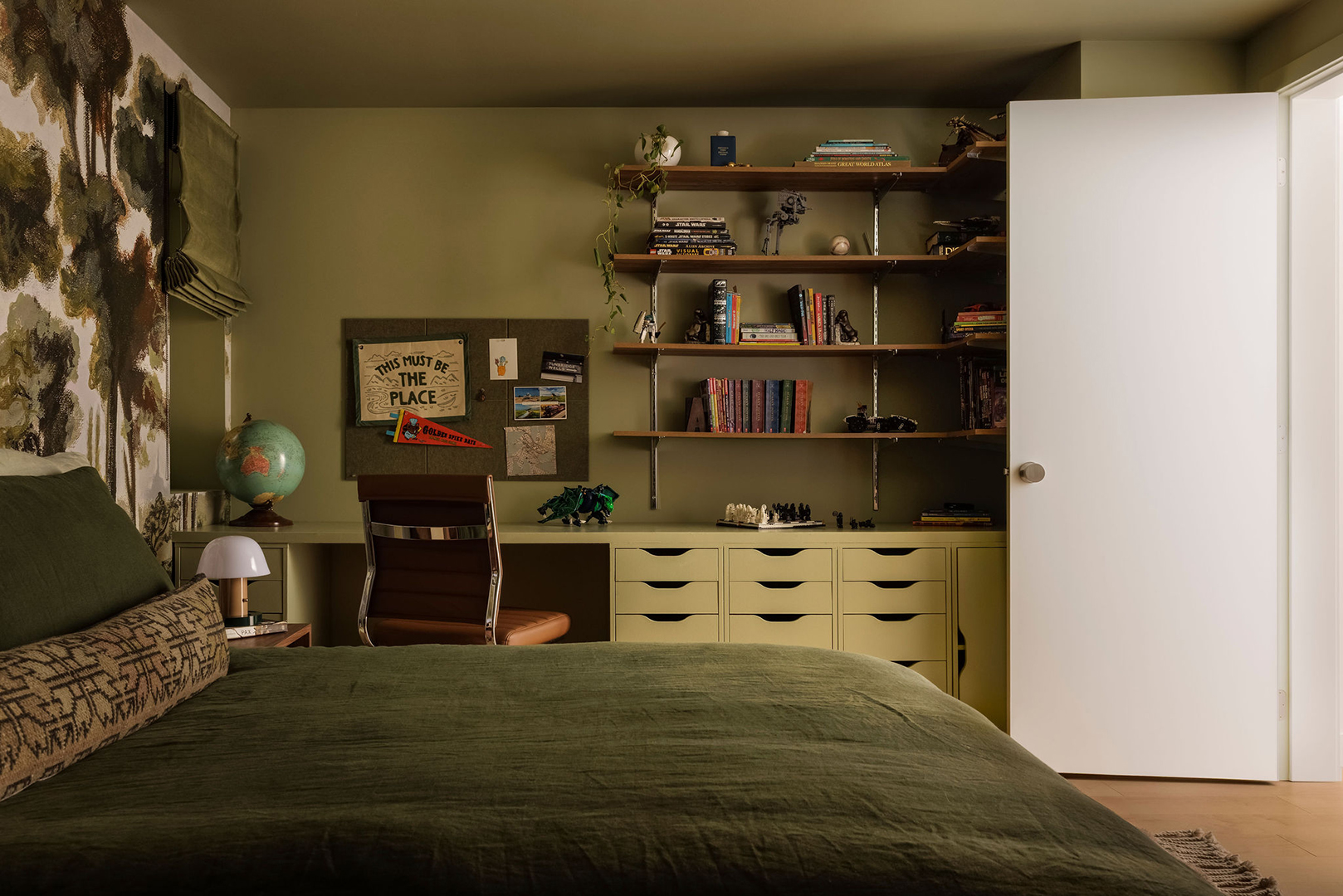 green bedroom with green bedding