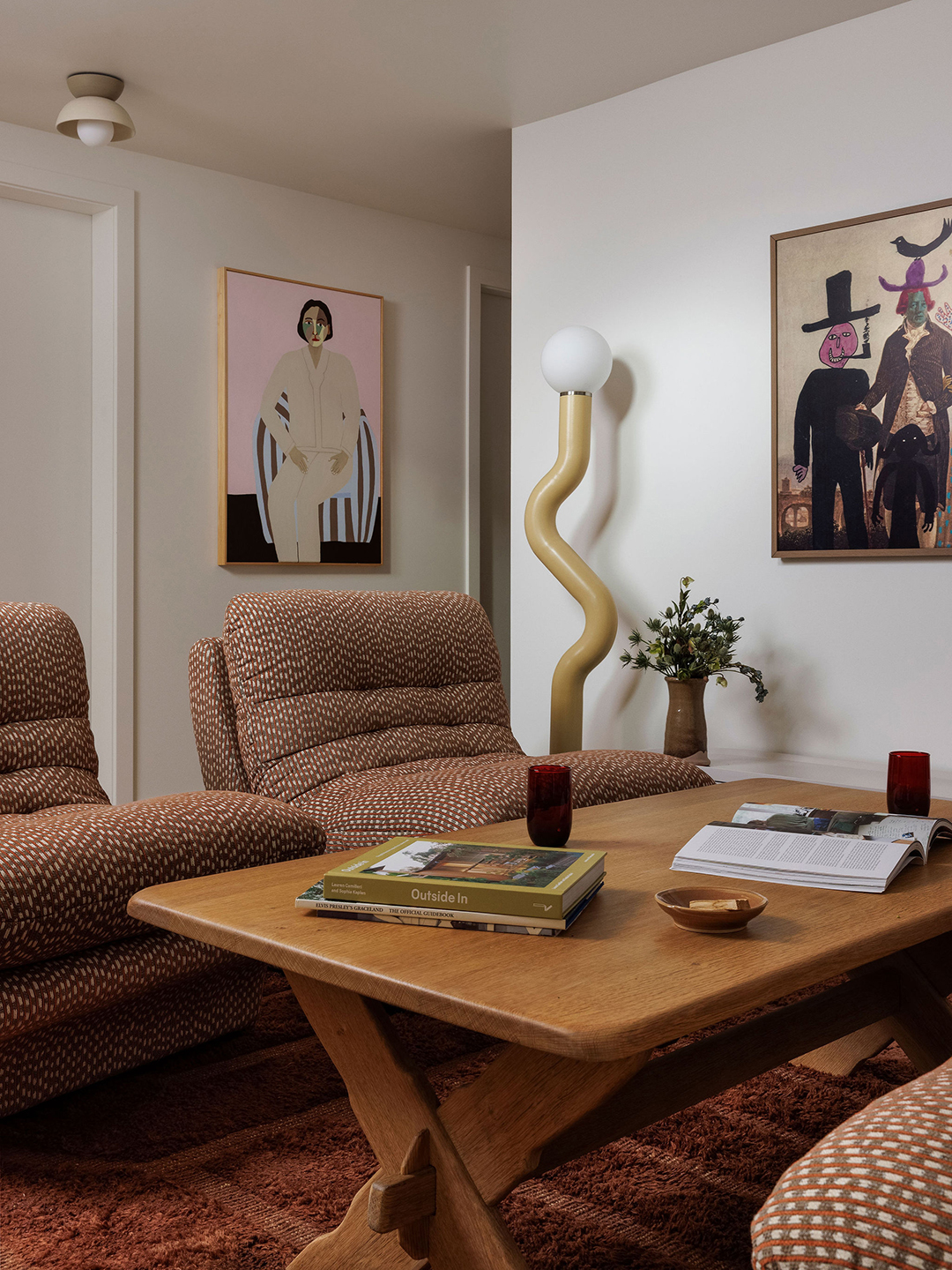living space with two chairs and a coffee table