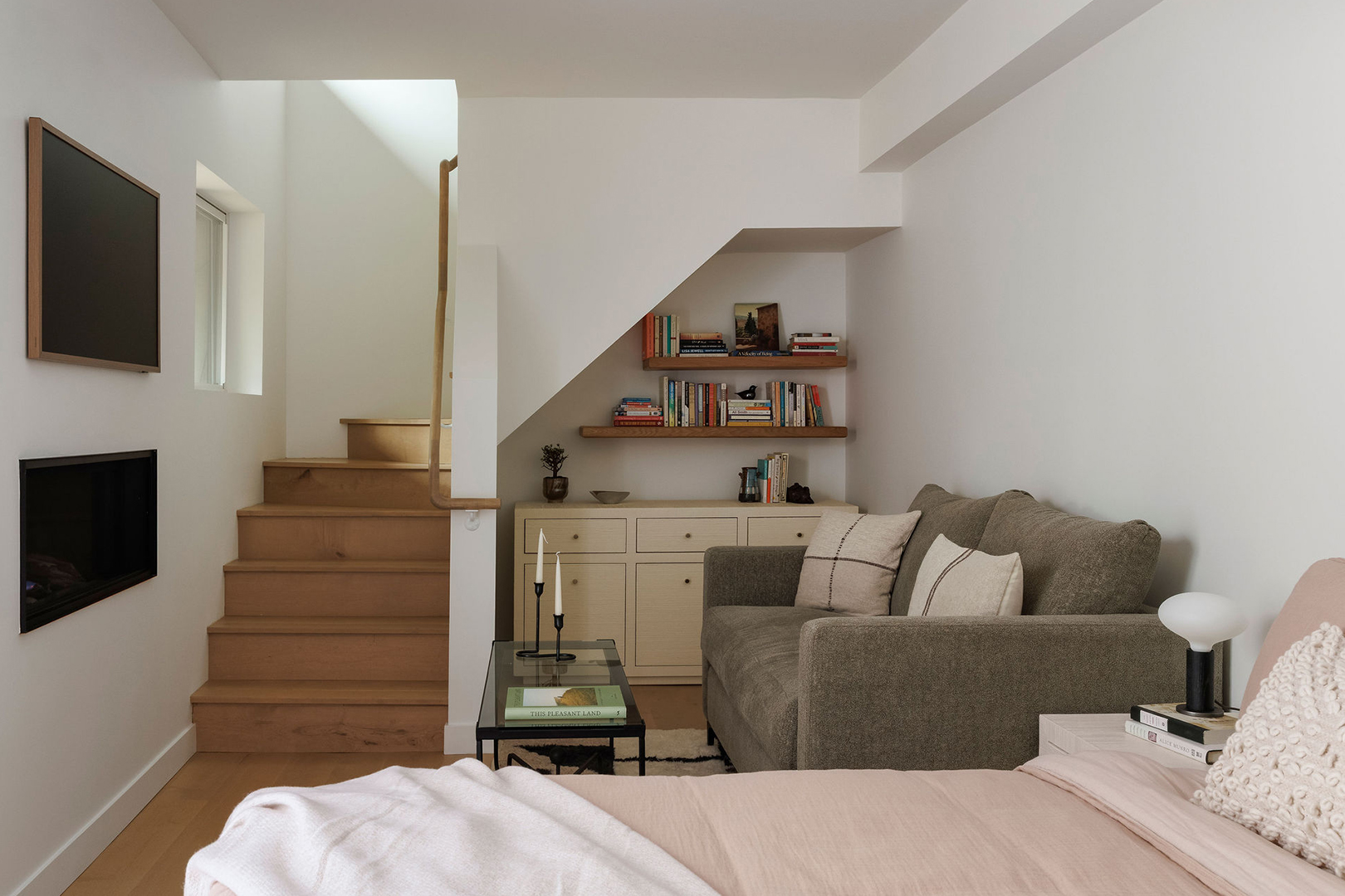 bedroom suite with bed and small sofa
