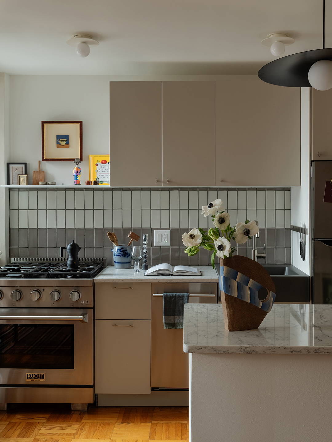 kitchen with grey cabinets and tiles