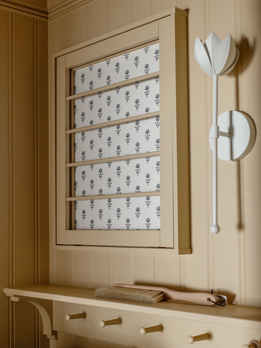 Drying racks on a laundry room wall