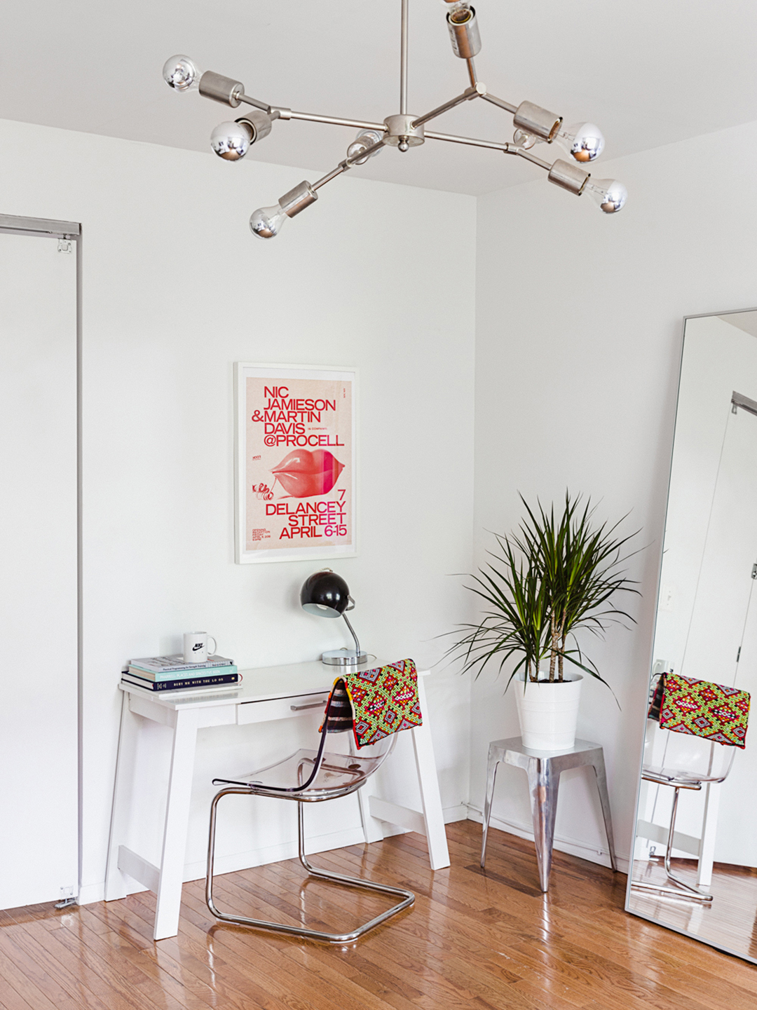 white room with white console desk