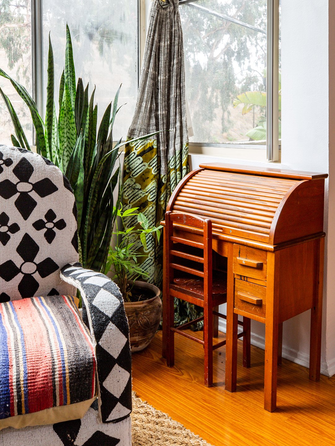 small secretary desk in corner