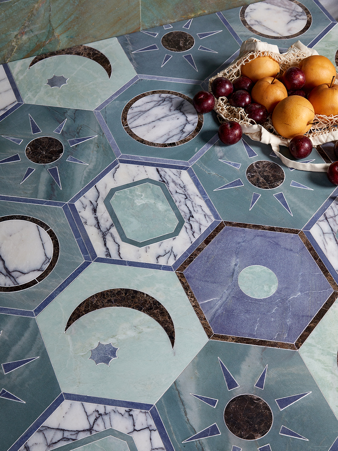 marble tiles with celestial motif and bag of fruit