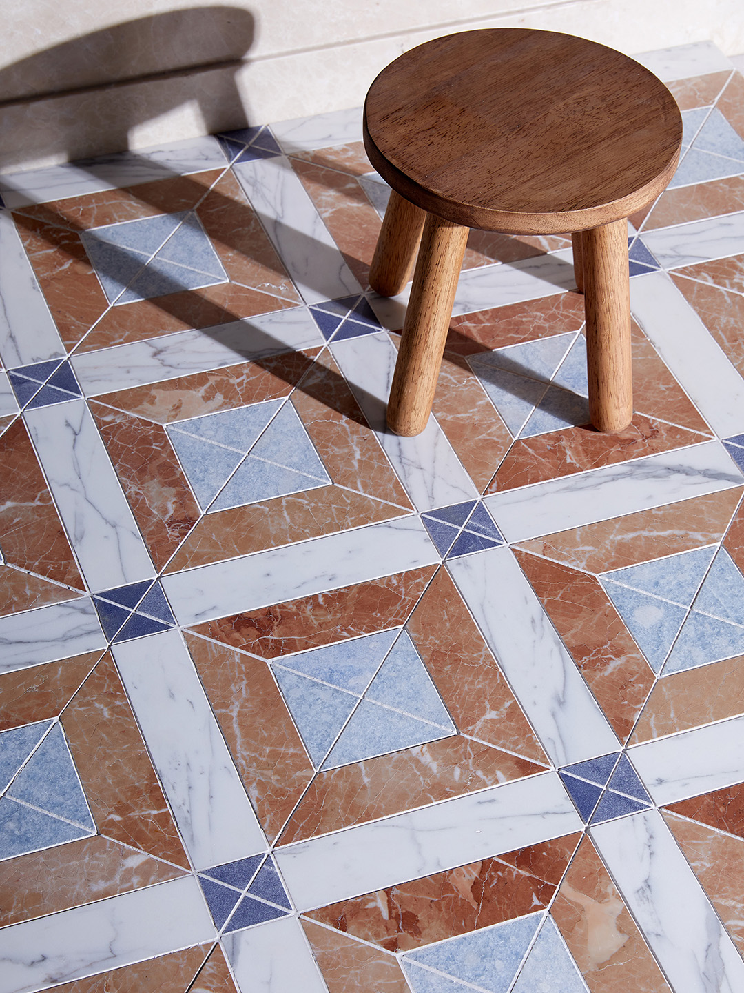 marble tiled floor with wood stool