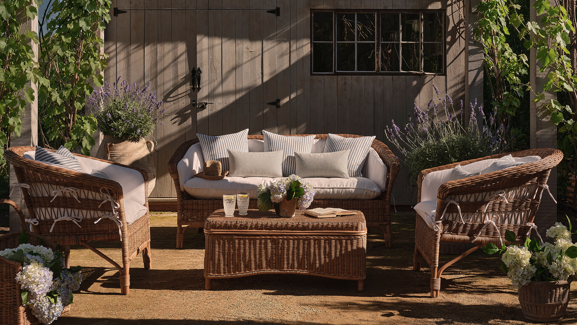 set of rattan furniture sitting outside