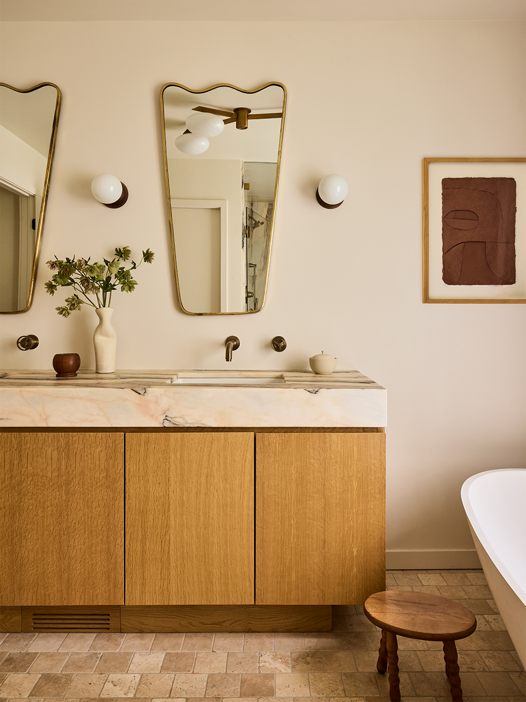 bathroom with wood-and-marble vanity