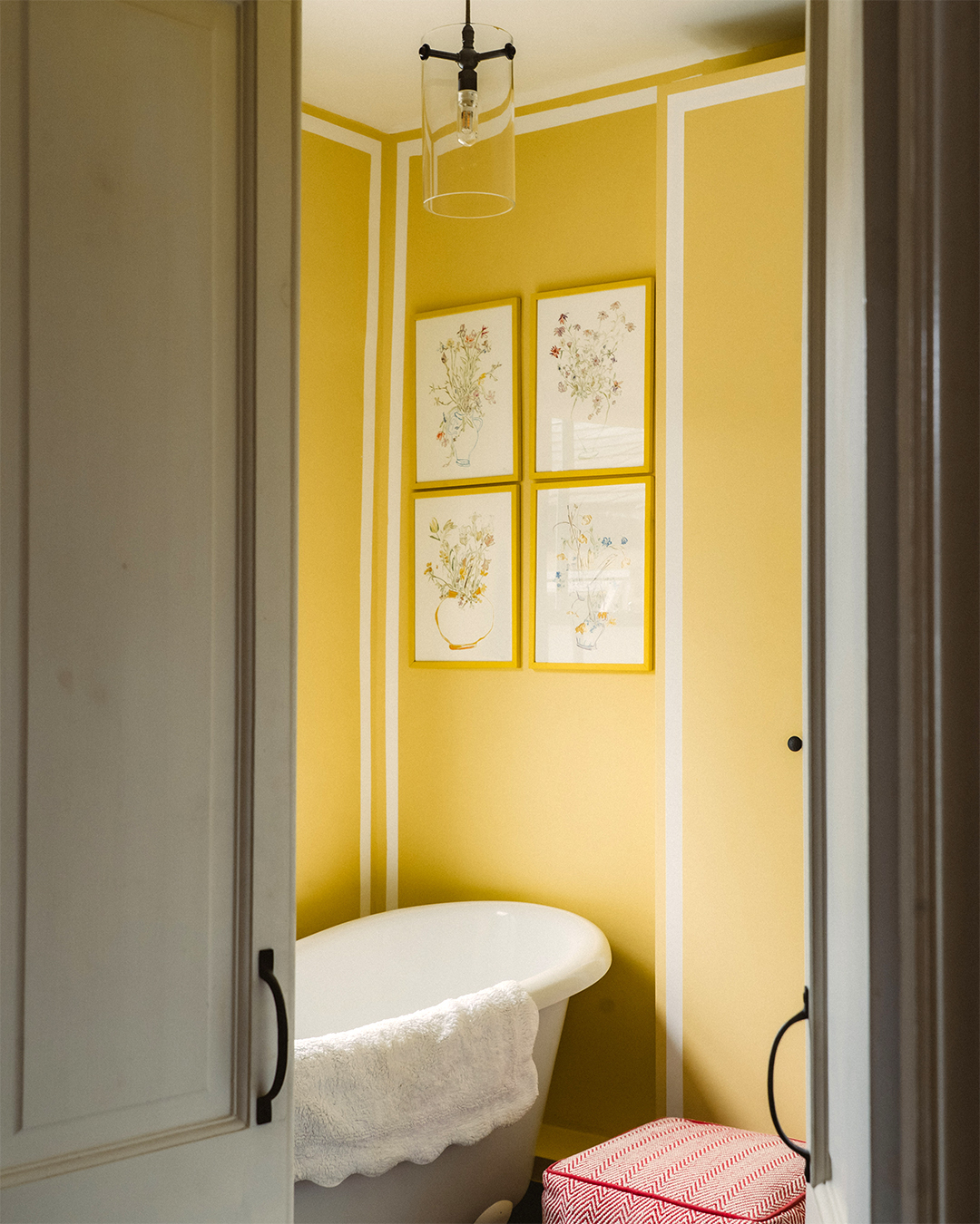 yellow bathroom with white tub
