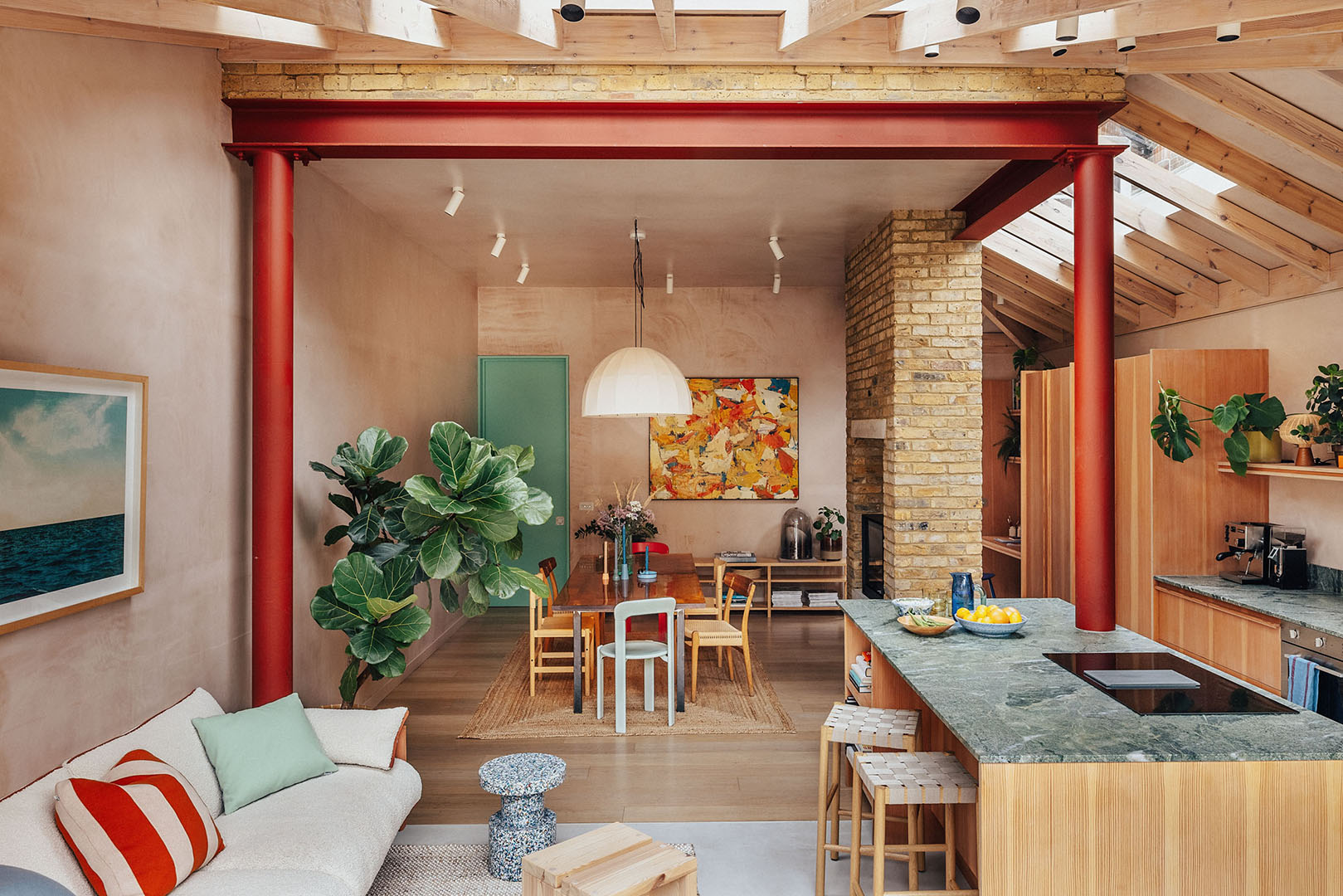 living room with exposed steel beam painted red