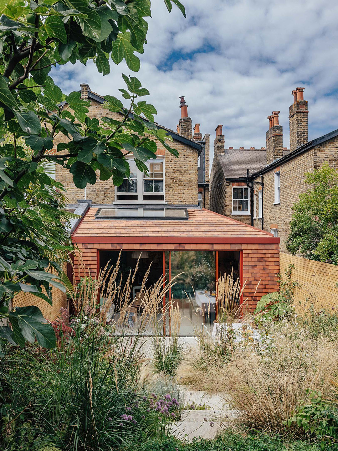 tiled single story extension on the back of a house