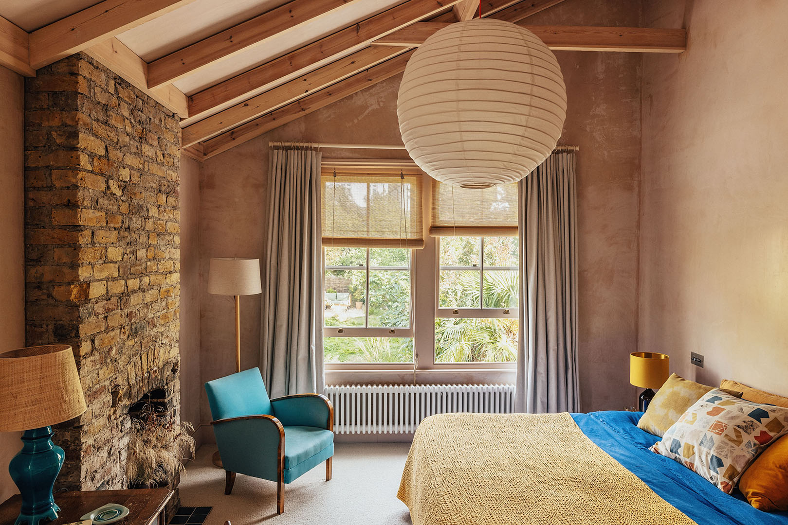 bedroom with exposed beams and slanted ceiling
