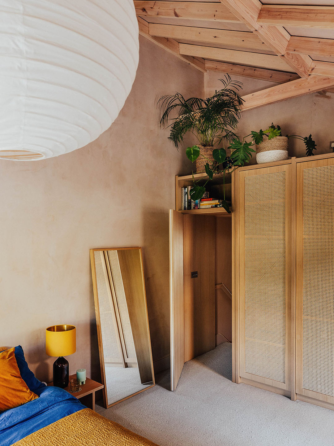 wicker cabinetry in the corner of a room