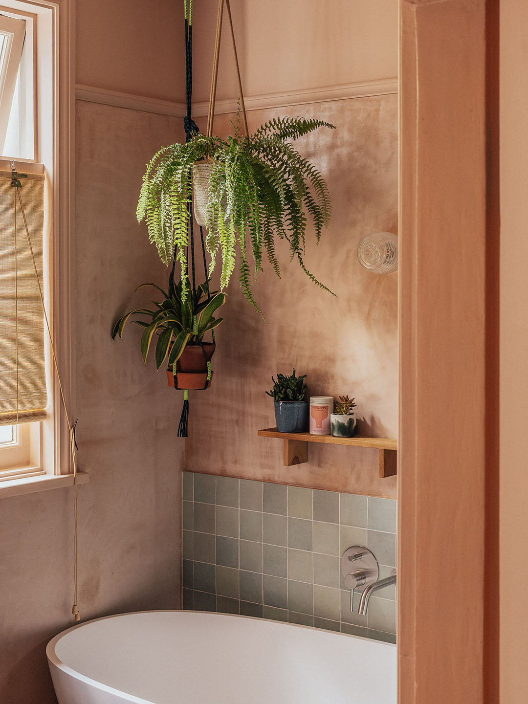 bathroom with plaster walls and rounded tub