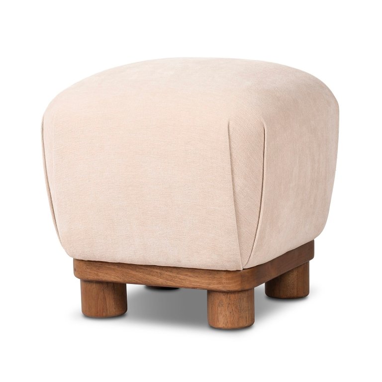  cream upholstered ottoman by Ashley Luxe
