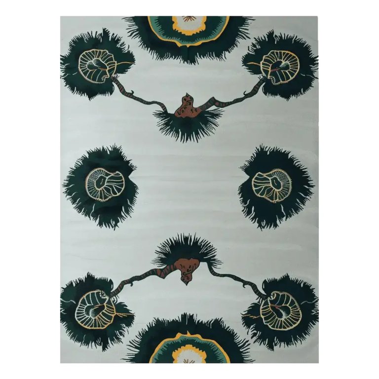 Light blue rug with black floral pattern on white background image.