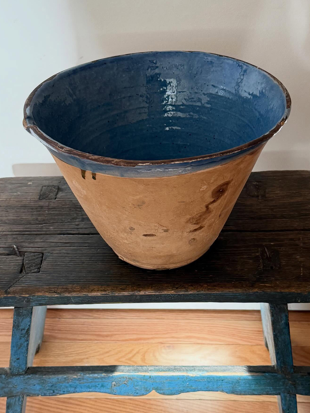 deep earthenware bowl with blue glazed interior
