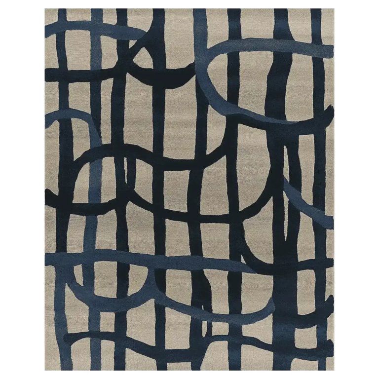 Dark beige rug with dark blue squiggly painted lines.