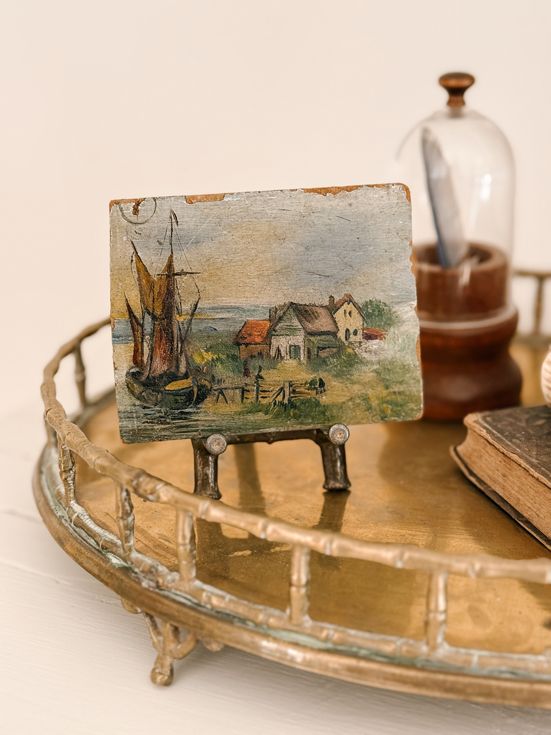 small painting on an easel on a tray