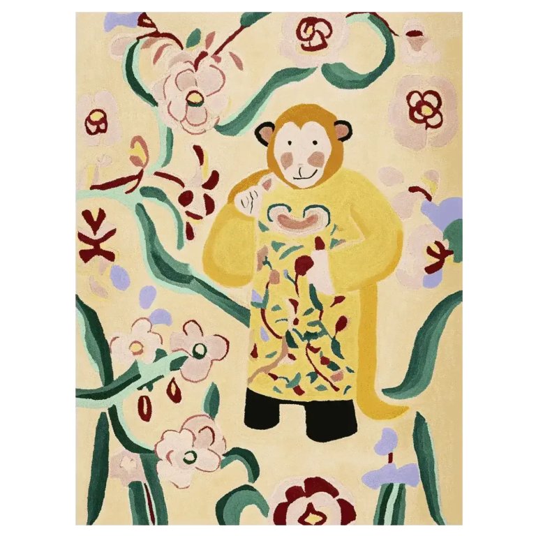 Cream-colored children's rug with monkey dressed in yellow robe surrounded by green vines.