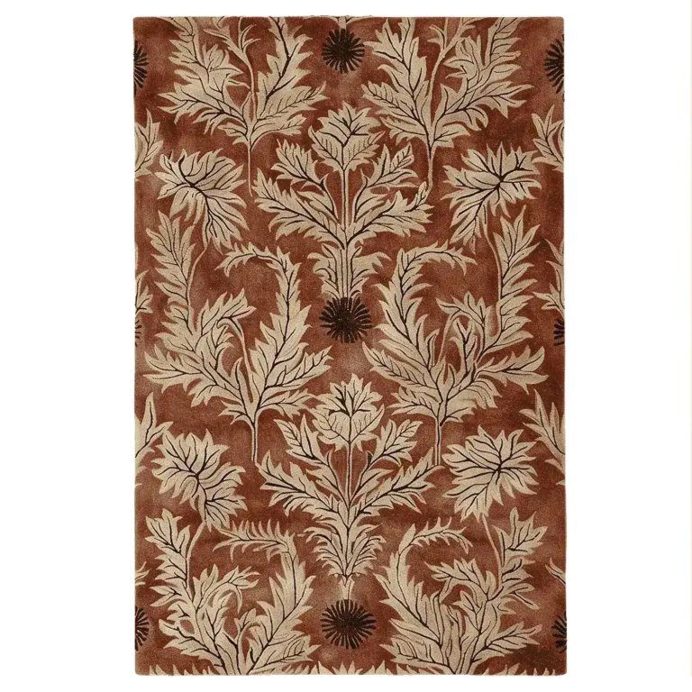 Rusty brown rug with thistle pattern on white background.