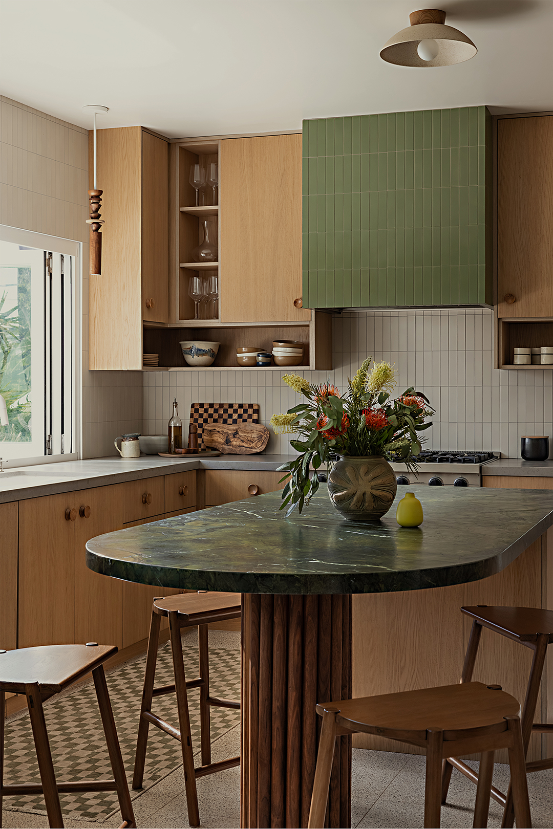 kitchen with wood cabinets and sage green accents