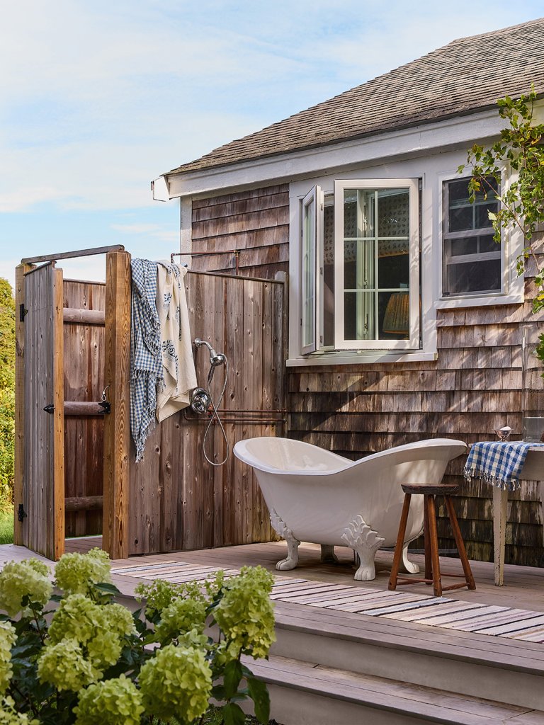 cottage exterior with white tub