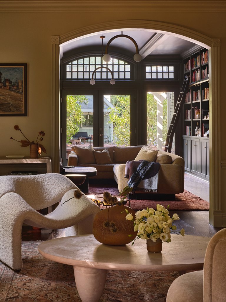 sitting area with chair and coffee table and view to living room