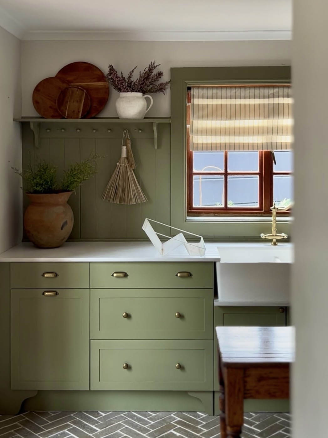 green kitchen with soft linen roman blinds