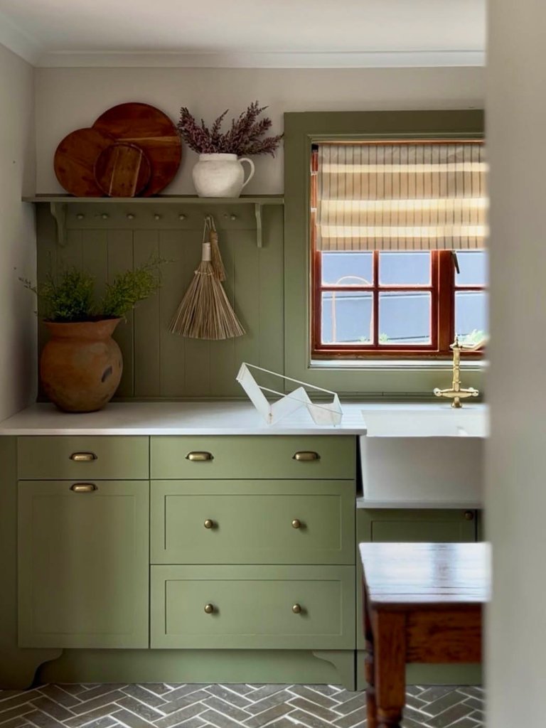 green kitchen with soft linen roman blinds