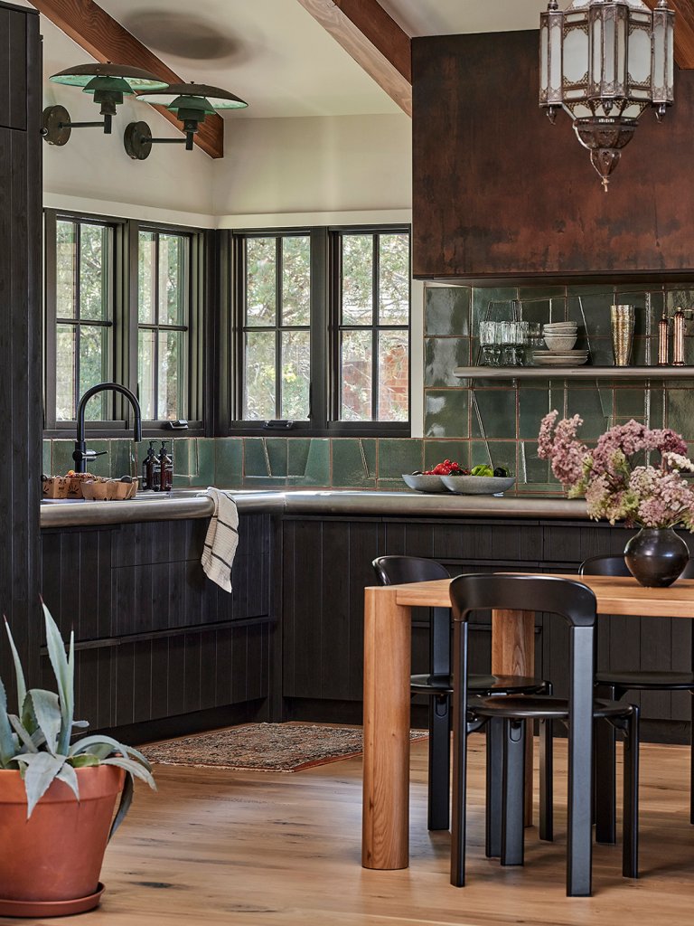 kitchen with tiled backsplash and large hood