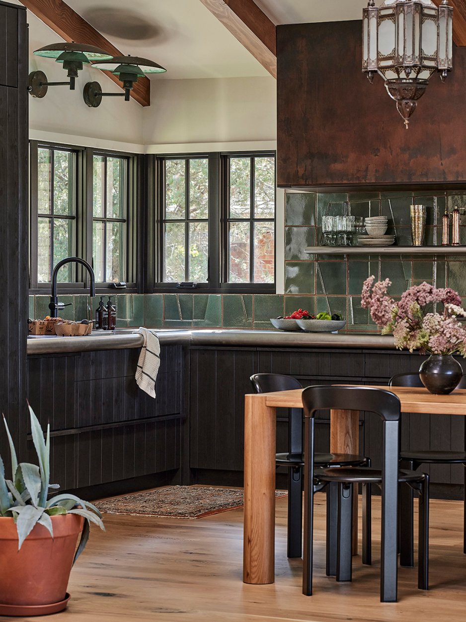 kitchen with tiled backsplash and large hood