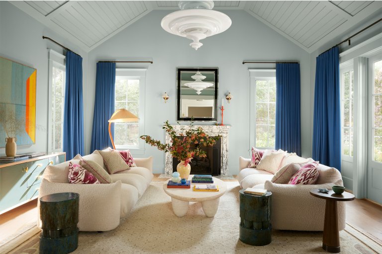 living room with blue walls and curtains