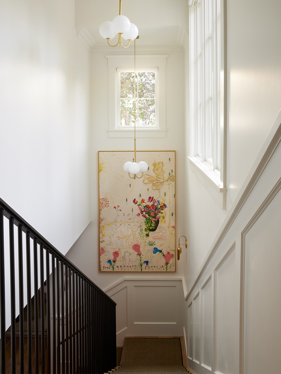 staircase with large painting on the wall
