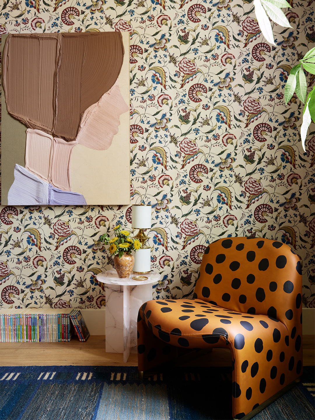 comfy spotted chair against wallpaper