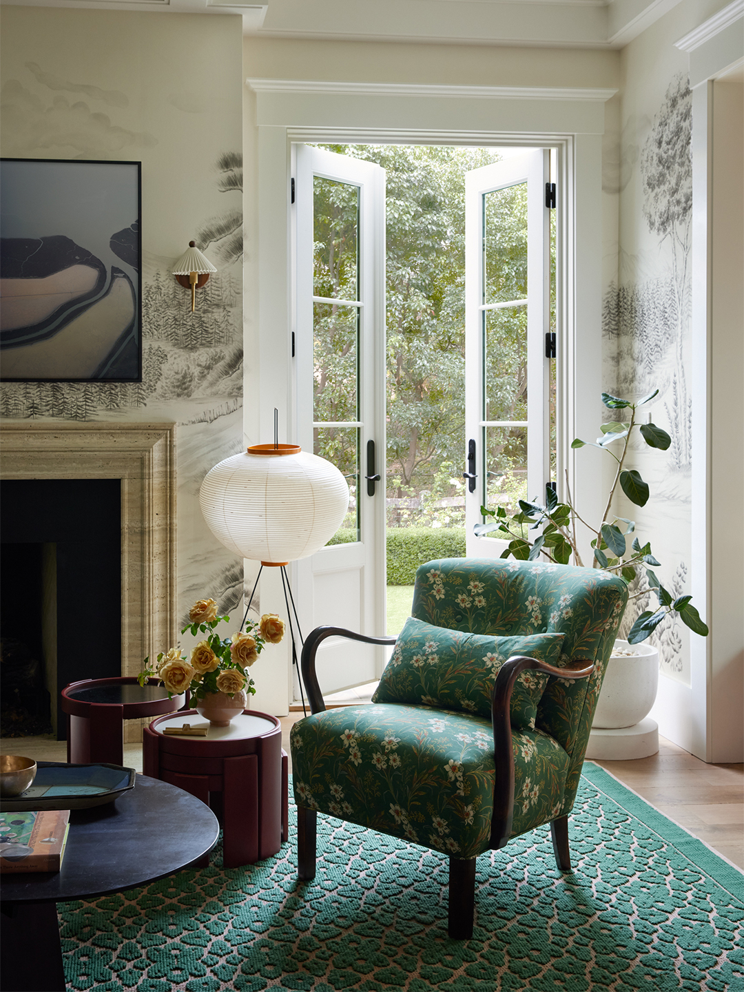 living room with green chair by French doors