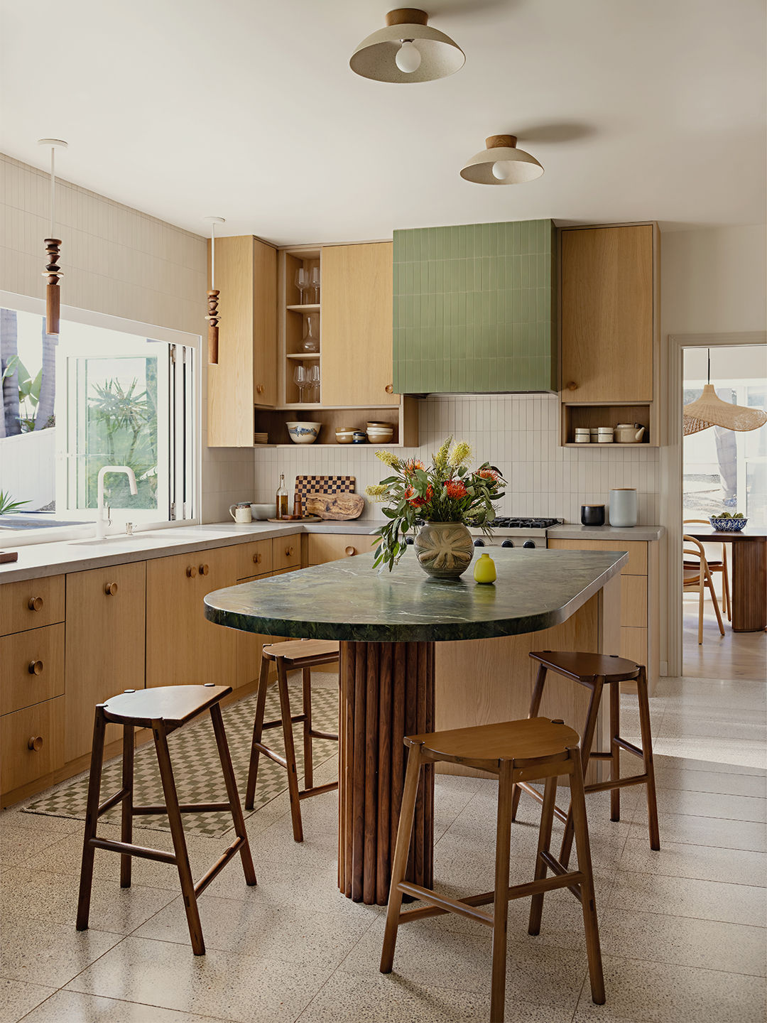 kitchen with wood cabinets and sage green accents