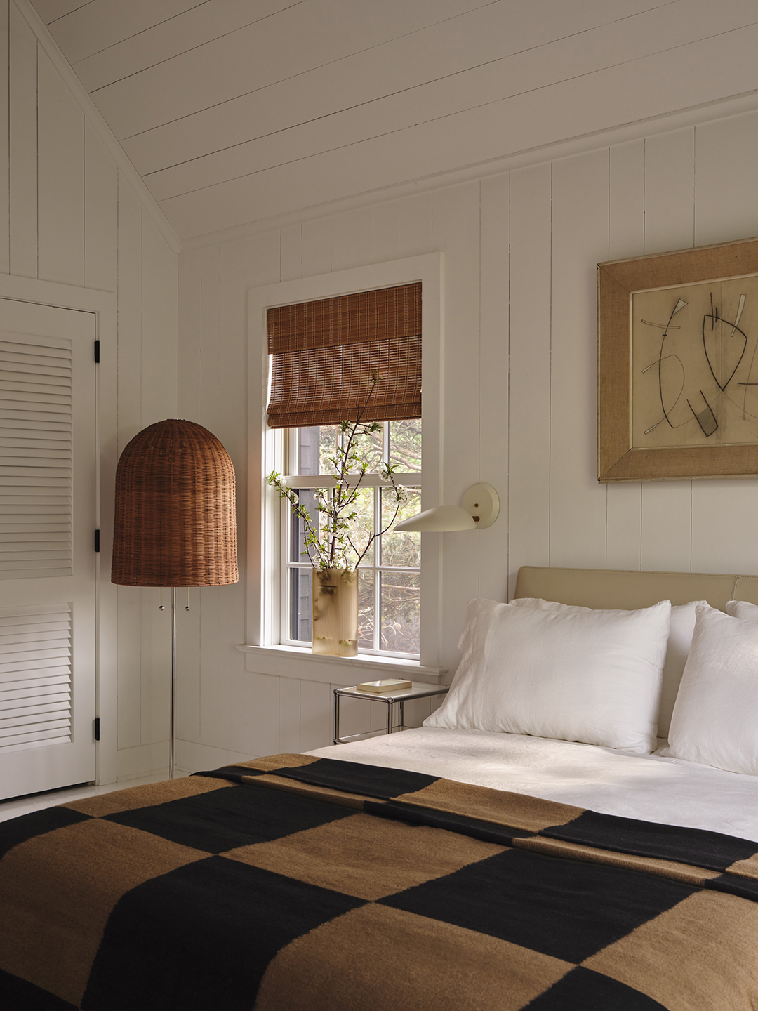 white-paneled bedroom