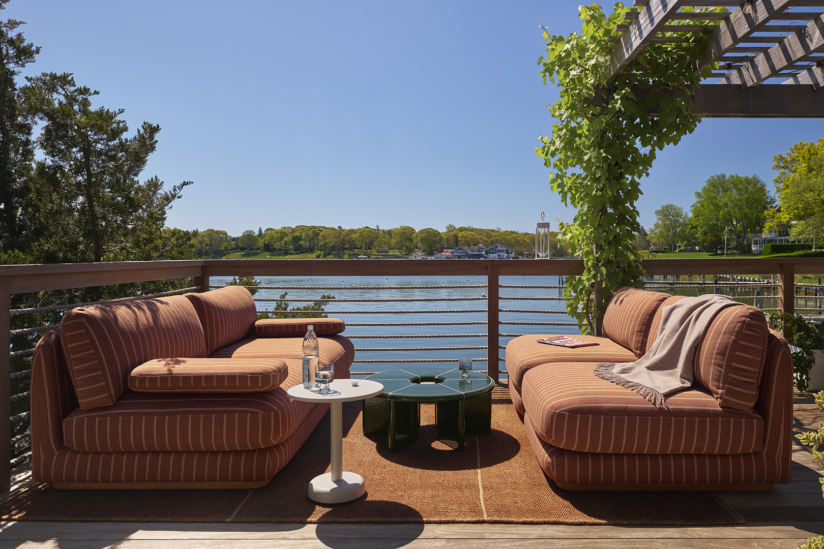 two terracotta outdoor sofas on deck